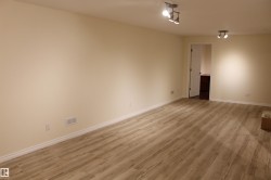 Spare room featuring light wood-style floors - 