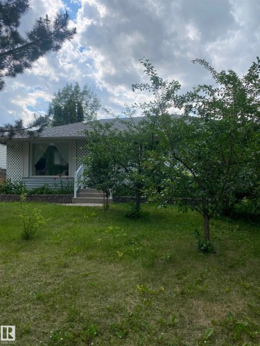 View of front of property with covered porch and a front lawn - 12432 134 Street, Edmonton, AB - Outdoor