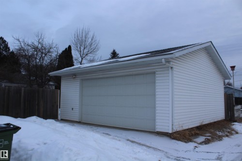 Snow covered garage featuring a detached garage - 12432 134 Street, Edmonton, AB - Outdoor With Exterior