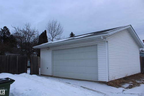 Snow covered garage featuring a detached garage - 12432 134 Street, Edmonton, AB - Outdoor