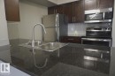 409 5810 Mullen Place, Edmonton, AB  - Indoor Photo Showing Kitchen With Stainless Steel Kitchen With Double Sink With Upgraded Kitchen 