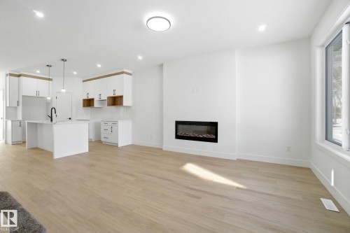 10723 70 Avenue, Edmonton, AB - Indoor Photo Showing Other Room With Fireplace