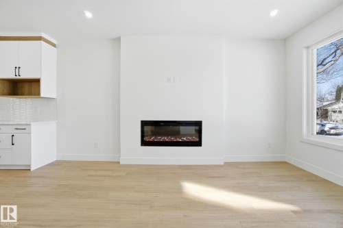 10723 70 Avenue, Edmonton, AB - Indoor Photo Showing Living Room With Fireplace