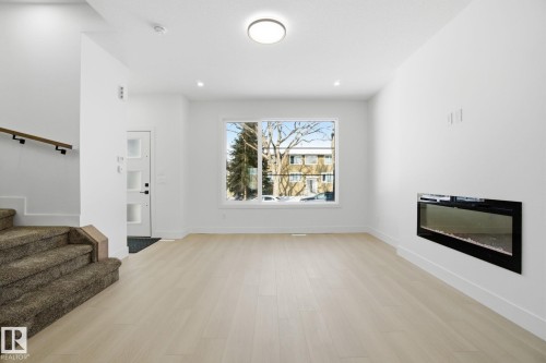 10725 70 Avenue, Edmonton, AB - Indoor Photo Showing Living Room With Fireplace