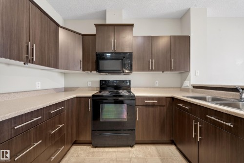 434 263 Macewan Road, Edmonton, AB - Indoor Photo Showing Kitchen With Double Sink