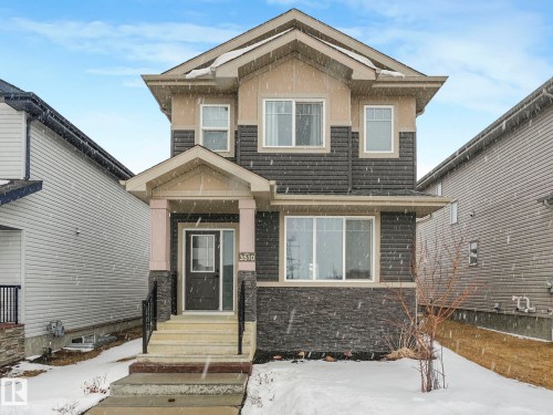 Craftsman house with stone siding and stucco siding - 3510 48 Avenue, Beaumont, AB - Outdoor With Facade