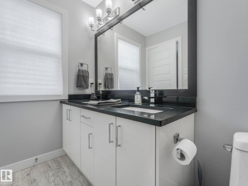 Bathroom featuring double vanity and toilet - 3510 48 Avenue, Beaumont, AB - Indoor Photo Showing Bathroom