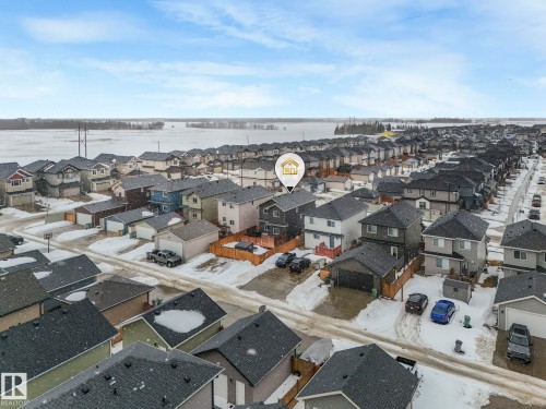Aerial perspective of suburban area featuring a large body of water - 3510 48 Avenue, Beaumont, AB - Outdoor With View