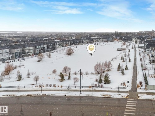 Snowy aerial view featuring a residential view - 3510 48 Avenue, Beaumont, AB - Outdoor With View