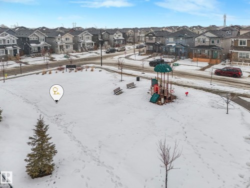 Snowy aerial view featuring a residential view - 3510 48 Avenue, Beaumont, AB - Outdoor With View