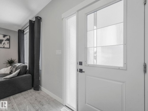 Doorway to outside featuring baseboards - 3510 48 Avenue, Beaumont, AB - Indoor Photo Showing Other Room