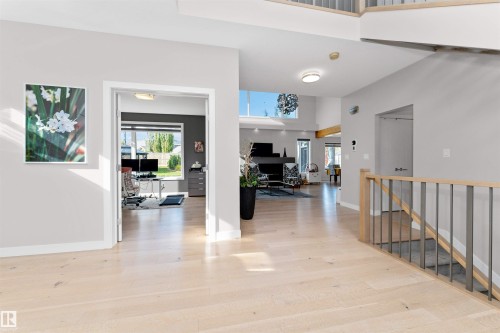 Entryway with a high ceiling and light wood-type flooring - 7404 May Common, Edmonton, AB - Indoor