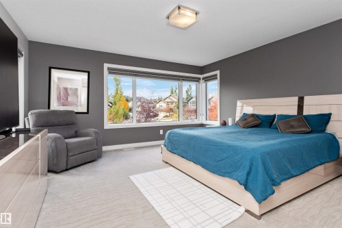 Bedroom featuring carpet flooring and baseboards - 7404 May Common, Edmonton, AB - Indoor Photo Showing Bedroom
