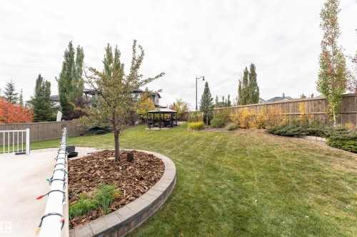 Fenced backyard featuring a gazebo and a patio area - 7404 May Common, Edmonton, AB - Outdoor