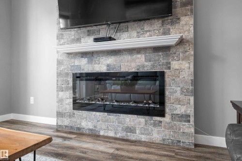 605 Boulder Wynd, Leduc, AB - Indoor Photo Showing Living Room With Fireplace