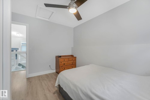 Bedroom with light wood-type flooring and ceiling fan - 2919 151A Avenue, Edmonton, AB - Indoor Photo Showing Bedroom