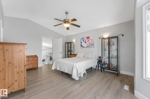 Bedroom featuring light wood-style floors, vaulted ceiling, and ceiling fan - 2919 151A Avenue, Edmonton, AB - Indoor Photo Showing Bedroom