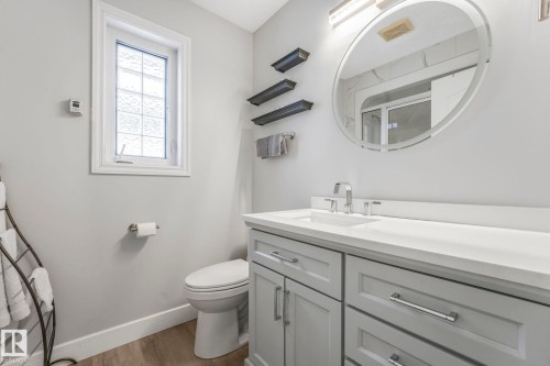 Bathroom with a shower stall, vanity, and light wood-style floors - 2919 151A Avenue, Edmonton, AB - Indoor Photo Showing Bathroom