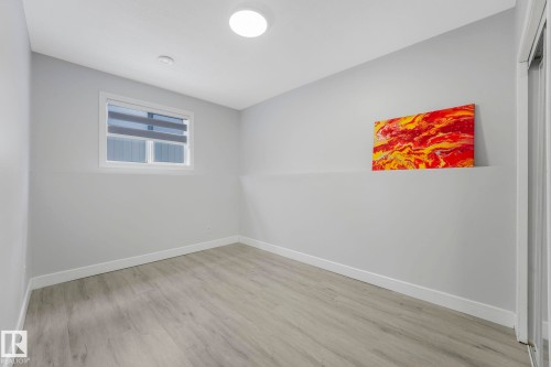 Unfurnished room with light wood-style floors - 2919 151A Avenue, Edmonton, AB - Indoor Photo Showing Other Room