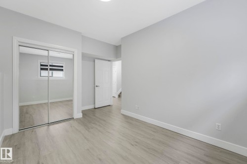 Unfurnished bedroom featuring a closet and light wood-style floors - 2919 151A Avenue, Edmonton, AB - Indoor Photo Showing Other Room