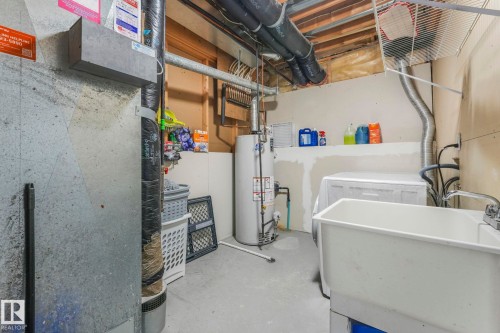 Utilities with a sink and gas water heater - 2919 151A Avenue, Edmonton, AB - Indoor Photo Showing Basement