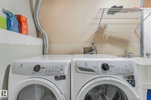 Laundry room with separate washer and dryer - 2919 151A Avenue, Edmonton, AB - Indoor Photo Showing Laundry Room