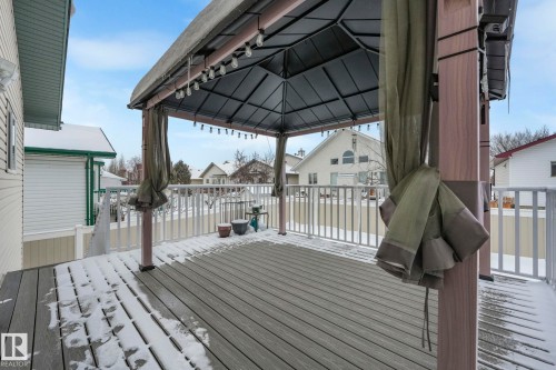 Wooden deck featuring a gazebo and a residential view - 2919 151A Avenue, Edmonton, AB - Outdoor With Deck Patio Veranda With Exterior