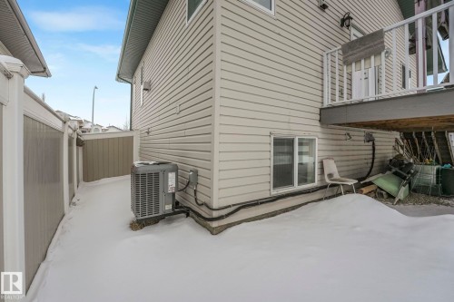 Snow covered property featuring a balcony and a patio area - 2919 151A Avenue, Edmonton, AB - Outdoor With Exterior
