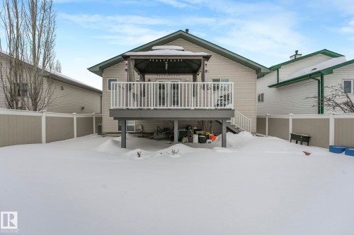Snow covered house featuring a gazebo and a deck - 2919 151A Avenue, Edmonton, AB - Outdoor With Deck Patio Veranda With Exterior