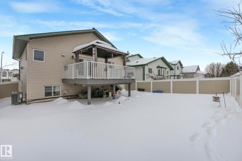 Snow covered back of property featuring a gazebo and a deck - 2919 151A Avenue, Edmonton, AB - Outdoor With Deck Patio Veranda