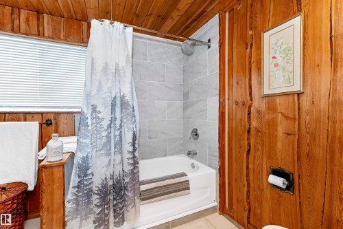 Bathroom featuring vanity, wood walls, and light tile patterned flooring - 516 5 Street, Rural Lac Ste. Anne County, AB - Indoor Photo Showing Bathroom