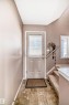 Doorway with stairway and tile patterned flooring - 2927 30 Street, Edmonton, AB  - Indoor Photo Showing Other Room 