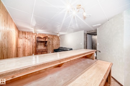 Bar area with wood walls and light countertops - 2927 30 Street, Edmonton, AB - Indoor Photo Showing Other Room