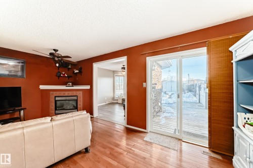 2927 30 Street, Edmonton, AB - Indoor Photo Showing Living Room With Fireplace