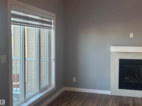 6694 Cardinal Road, Edmonton, AB - Indoor Photo Showing Other Room With Fireplace