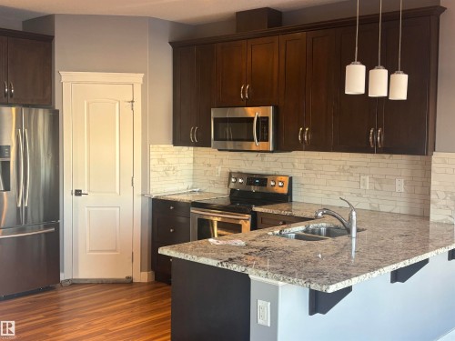 6694 Cardinal Road, Edmonton, AB - Indoor Photo Showing Kitchen With Stainless Steel Kitchen With Double Sink With Upgraded Kitchen