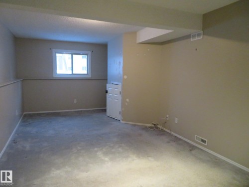 Below grade area with baseboards and carpet flooring - 1855 Mill Woods Road E, Edmonton, AB - Indoor