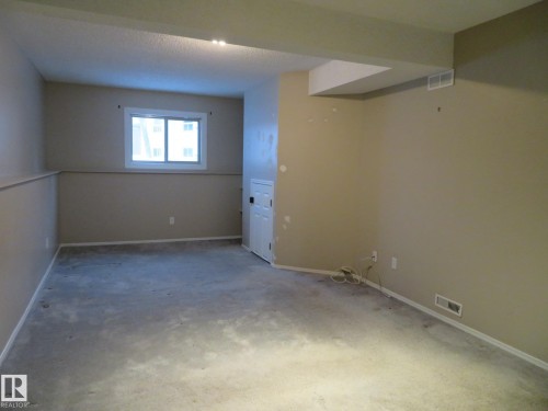 Basement with baseboards and carpet floors - 1855 Mill Woods Road E, Edmonton, AB - Indoor