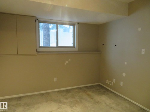Spare room with baseboards and light colored carpet - 1855 Mill Woods Road E, Edmonton, AB - Indoor Photo Showing Other Room
