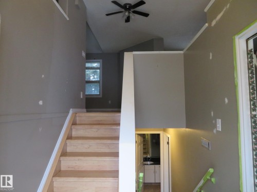 Staircase featuring a ceiling fan - 1855 Mill Woods Road E, Edmonton, AB - Indoor Photo Showing Other Room