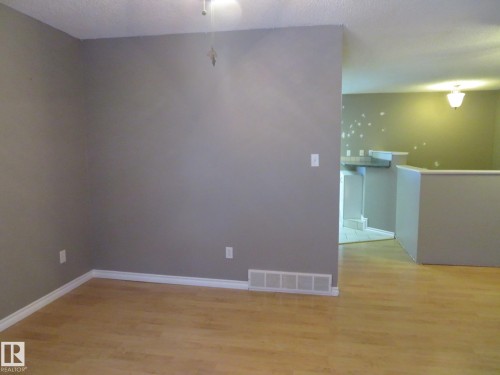Spare room featuring light wood-style floors - 1855 Mill Woods Road E, Edmonton, AB - Indoor Photo Showing Other Room