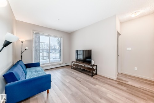 108 1144 Adamson Drive, Edmonton, AB - Indoor Photo Showing Living Room