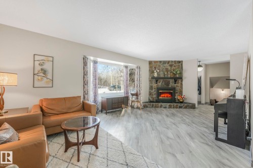 4835 60 Street, Rural Lac Ste. Anne County, AB - Indoor Photo Showing Living Room With Fireplace