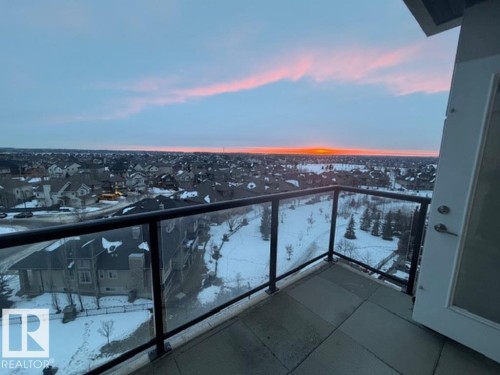 Snow covered back of property featuring a residential view - 706 5151 Windermere Bv, Edmonton, AB - Outdoor With View