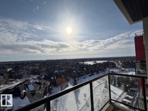 Snow covered back of property featuring a residential view - 706 5151 Windermere Bv, Edmonton, AB - Outdoor With View