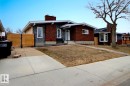 Brick and stone facade residence featuring a concrete driveway and sidewalk - 10519 173 Avenue, Edmonton, AB  - Outdoor 