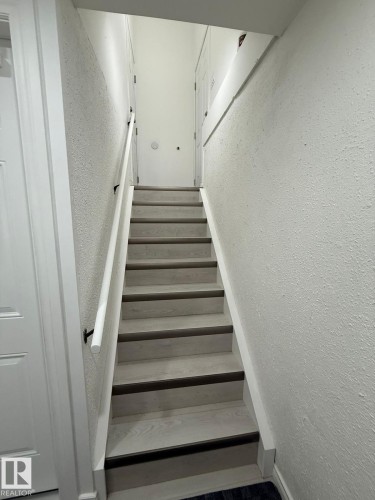 Staircase with a textured wall - 10519 173 Avenue, Edmonton, AB - Indoor Photo Showing Other Room