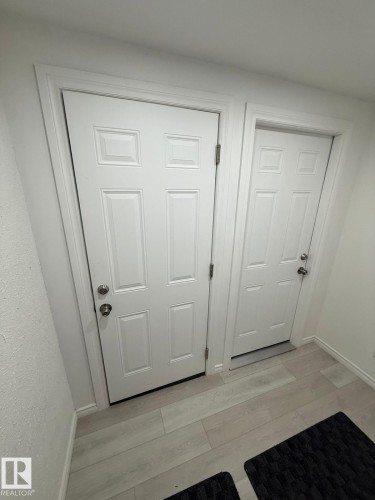 Doorway to outside featuring wood finished floors and baseboards - 10519 173 Avenue, Edmonton, AB - Indoor Photo Showing Other Room