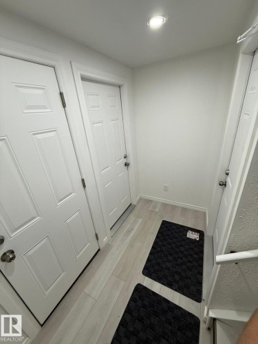 Doorway to outside featuring wood finished floors and baseboards - 10519 173 Avenue, Edmonton, AB - Indoor Photo Showing Other Room