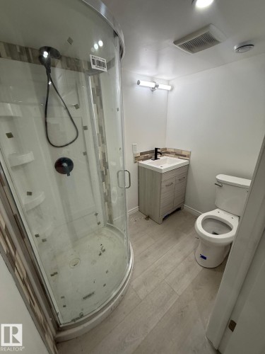 Full bathroom with vanity, light wood-style flooring, and a shower stall - 10519 173 Avenue, Edmonton, AB - Indoor Photo Showing Bathroom